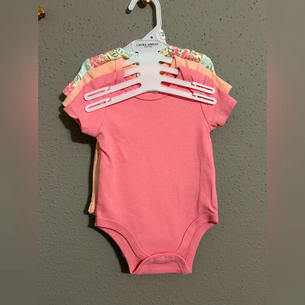 Laura Ashley Floral and Pink Bodysuit Set. (Set of 3 shirts)